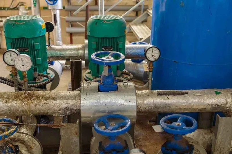 Backflow preventer repair in progress showing replacement of check valve disc